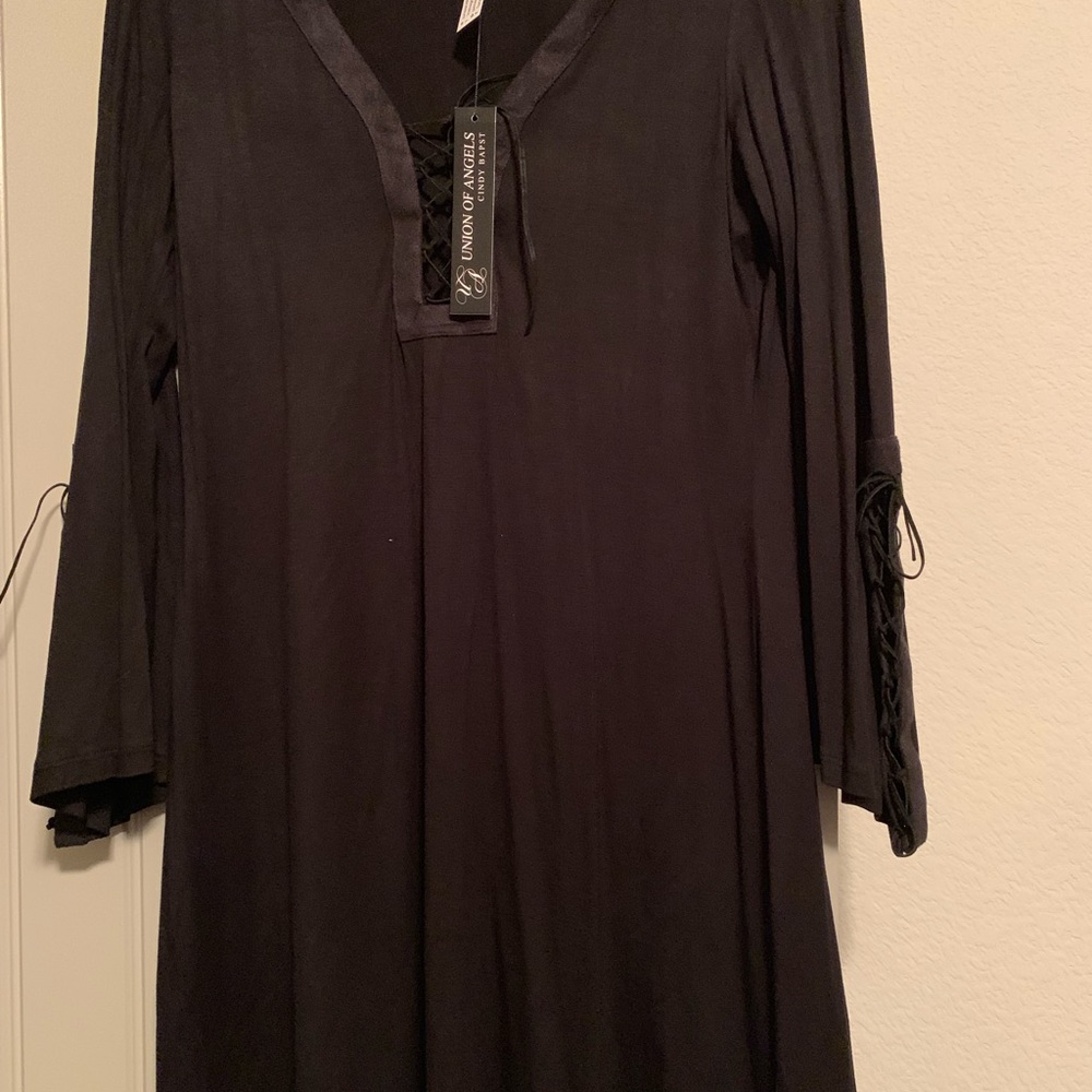 Black dress with lace up front and leather trim